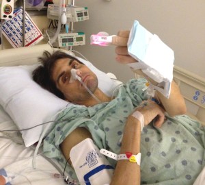 This is the first picture of me after surgery. I was hoping it'd be a nicer, more upbeat image, but I was in a foul mood, and the heart monitor on my finger facilitated this special message to the doctors.